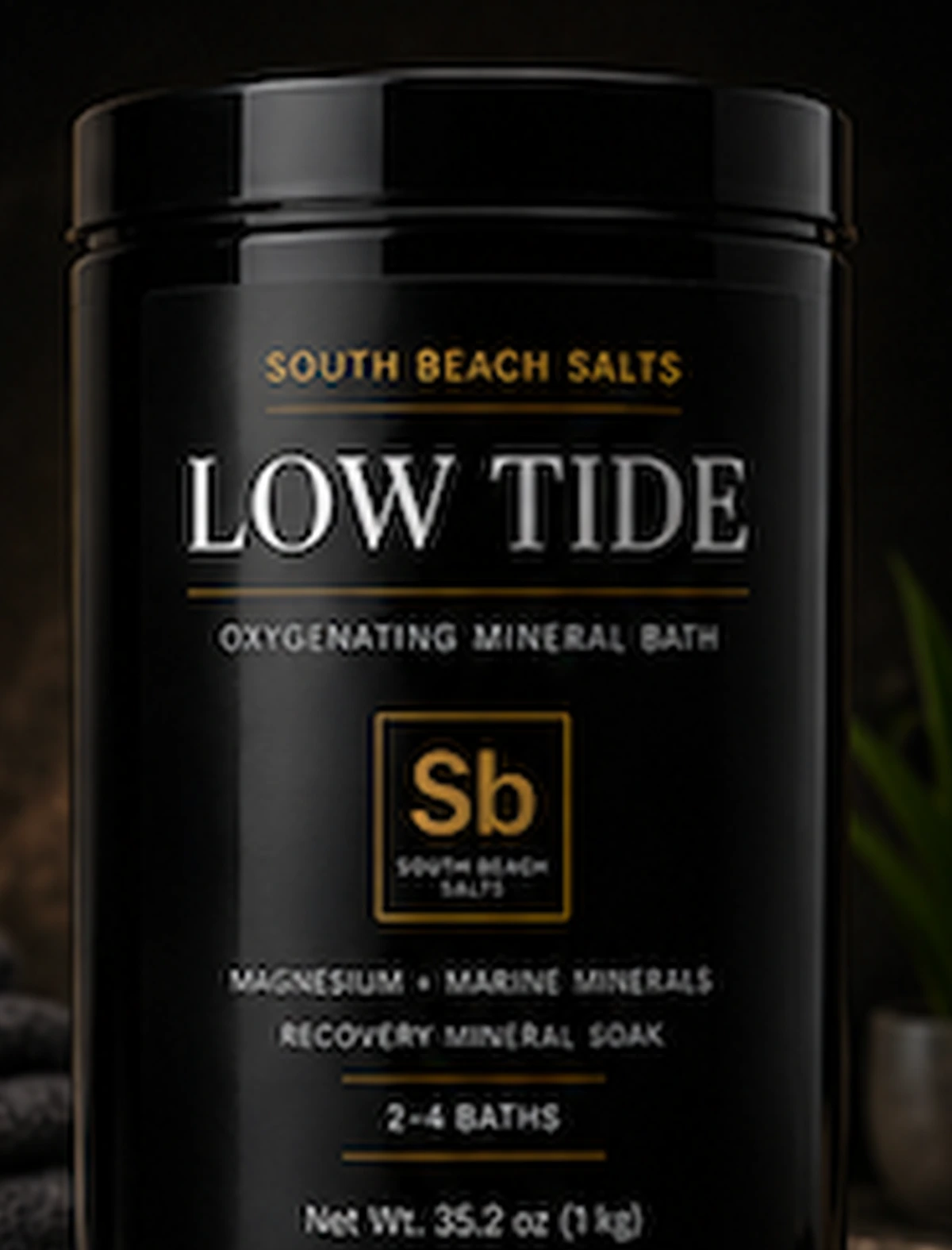 Close view of the black and gold South Beach Salts Low Tide jar